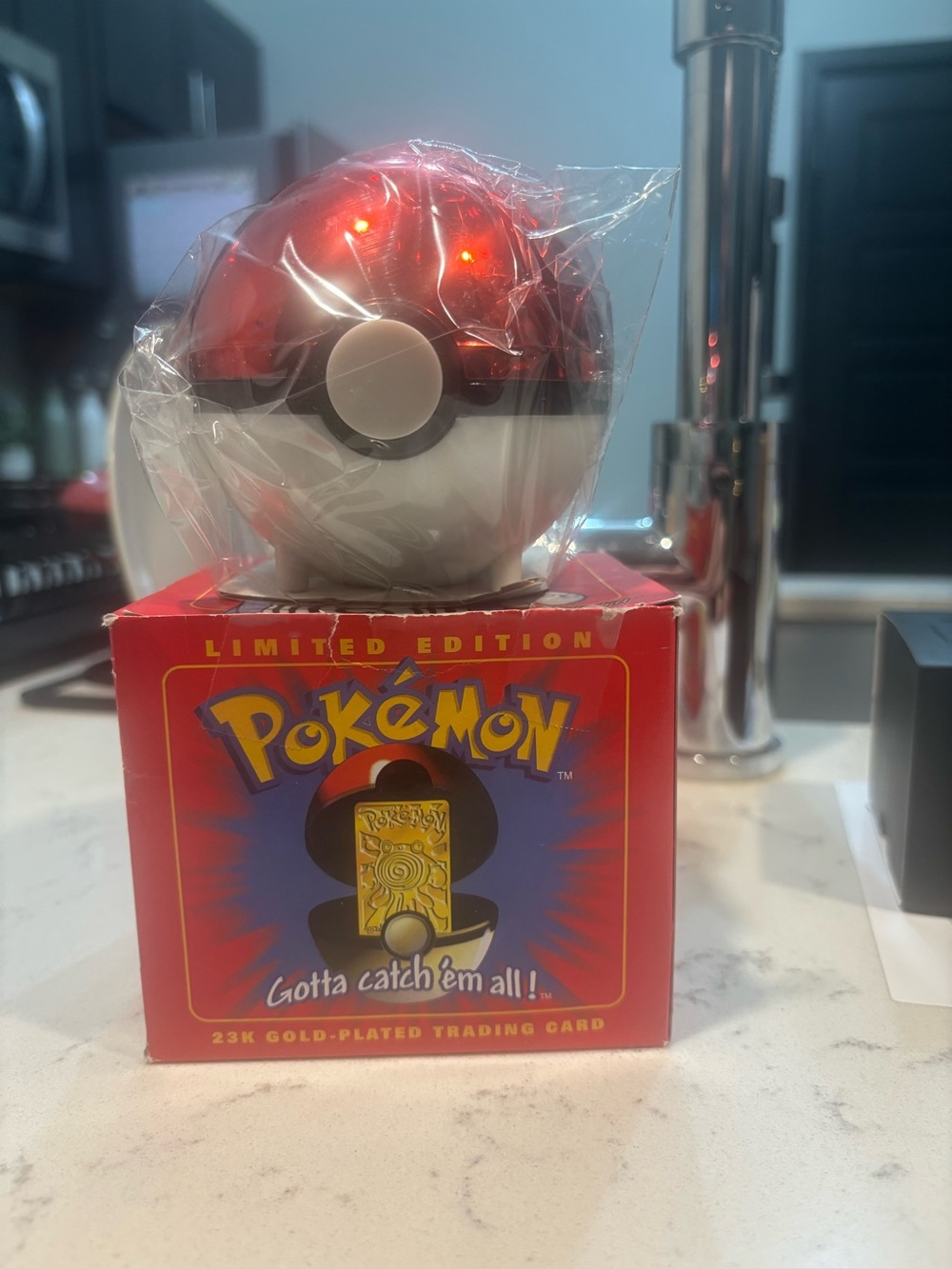 Limited Edition Pokéman Ball with 23k gold plated trading card inside never open